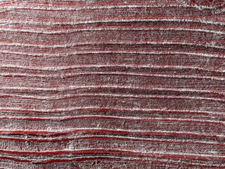 Abstract background from curved lines surface. Rural field with car trails. Image contains noise, blur and chromatic aberration. Futuristic looking style. Toned image with pink color