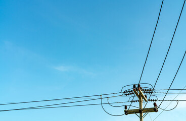 Electric pole and blue sky. Power and energy. Three-phase electric power for transfer power by...