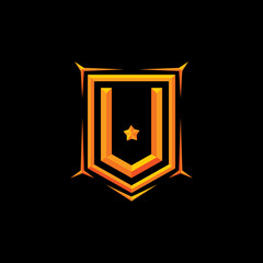 Pentagonal badge with embossed 3d effect of letter V in gold color.