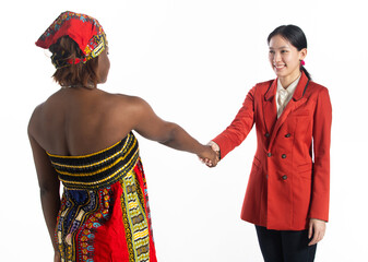 Multiethnic young women shake hands together, Business woman smile positive expressions. Multiracial African woman, Asian female, two persons, Racial unity business concept. white background Isolated