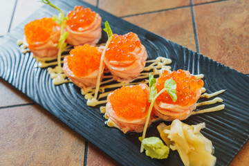Japanese cuisine : Salmon rolls with tobiko and salmonkun