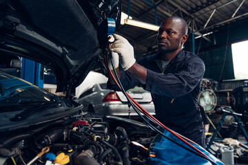 Fototapeta na wymiar Auto mechanic are repair and maintenance auto engine is problems at car repair shop. 