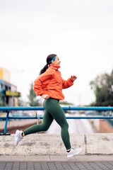 Happy Woman Running Outdoors