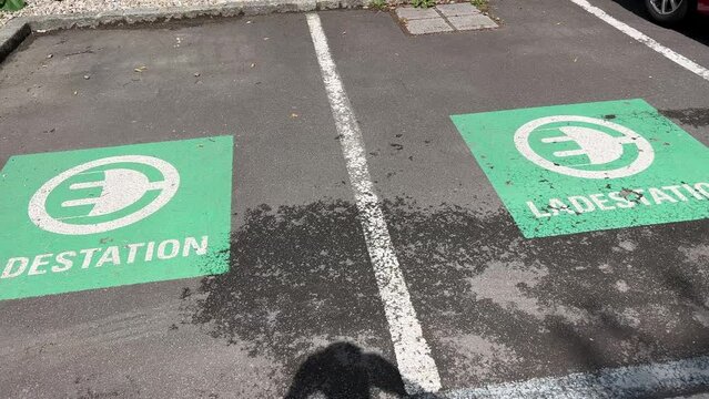 electic vehicle icons on parking lot