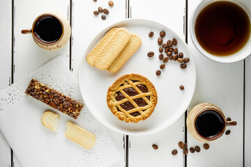 Coffee with coockie, sweet morning brackfast with copy space for menu, white backgroud, wallpaper