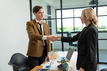 Shot crop of business people shaking hands inside office, Business meeting and partnership concepts.