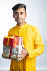 Man holding gift boxes during Diwali festival