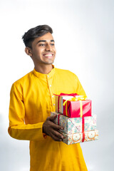 Man holding gift boxes during Diwali festival