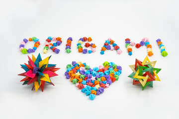 Origami sign and heart creative concept made of bunch of multi colored origami stars