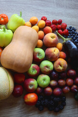 Various healthy fresh fruit and vegetable on wooden table. Top view.