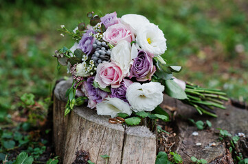 Beautiful tender wedding bouquet and rings.