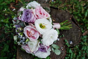Beautiful tender wedding bouquet and rings.