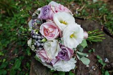 Beautiful tender wedding bouquet and rings.