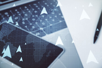 Creative concept of geolocations map on modern laptop background. GPS tracking and navigation concept. Multiexposure