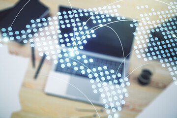 Abstract creative world map with connections on modern laptop background, international trading concept. Multiexposure