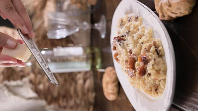 risotto with porcini mushrooms. Risotto with porcini mushrooms.Typical Italian food white rice with mushrooms in parmesan sauce. Antipasto for dinner. High quality 4k footage. Vertical