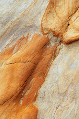 Natural rock texture of a colorful rock formations in silence beach (playa del Silencio) in Asturias, north of Spain.
