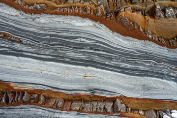 Natural rock texture of a colorful rock formations in silence beach (playa del Silencio) in Asturias, north of Spain.