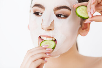 Female face with perfect skin and white spa mask.