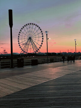 pier with Ferris  wheel at dusk