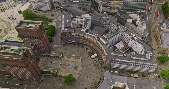 Oslo Norway v7 birds eye view drone fly around fridtjof nansen's place the circular square, tilt up capturing rådhuset city hall and fjord waterfront harbor view - Shot with Mavic 3 Cine - June 2022