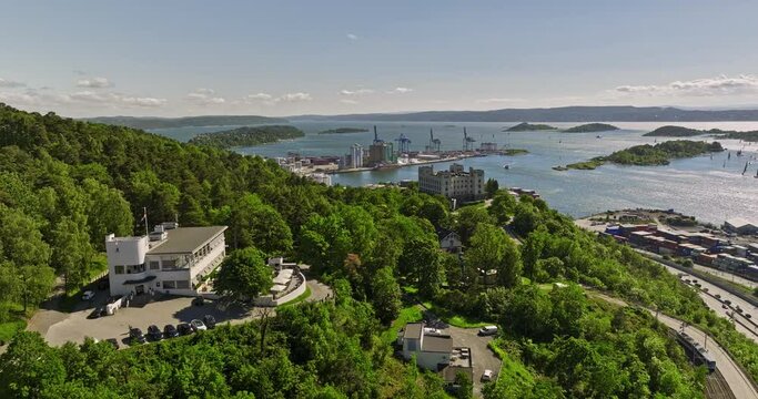 Oslo Norway v16 cinematic low level drone flyover bekkelaget hillside neighborhood capturing waterfront shipyard and yachts and sailboats on the fjord in summer - Shot with Mavic 3 Cine - June 2022