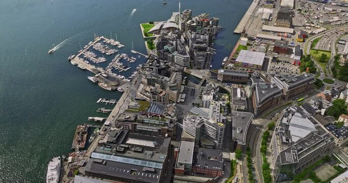 Oslo Norway v36 birds eye view drone fly around tjuvholmen and aker brygge neighborhoods capturing upscale waterfront eateries with inner oslofjord view in summer - Shot with Mavic 3 Cine - June 2022