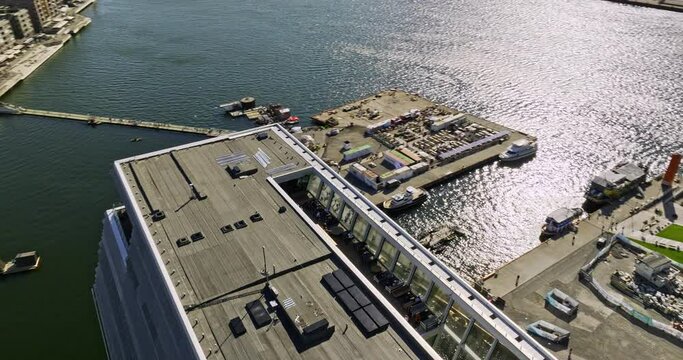 Oslo Norway v25 cinematic birds eye view drone fly around and above munch museum, tilt up reveals contemporary architecture the iconic opera house art theatre - Shot with Mavic 3 Cine - June 2022