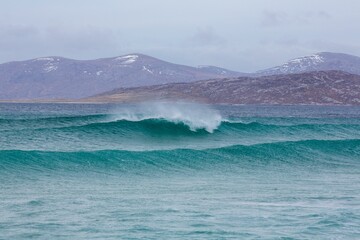 Beautiful shot of waves washing up the shore in Harris, Outer Hebrides