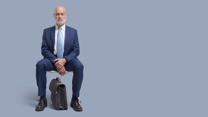 Corporate businessman waiting for a meeting