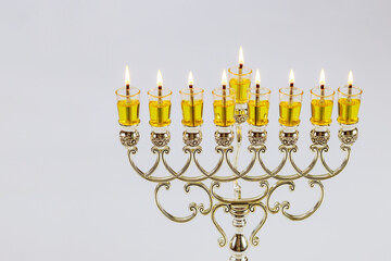 Candles for Hanukkah festival symbols have been lit in Menorah Jewish holiday with white background