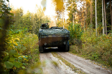 Obraz na płótnie Canvas Military training on the battlefield with armored vehicles. Army war concept.