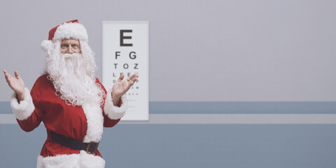 Cheerful Santa having a vision test
