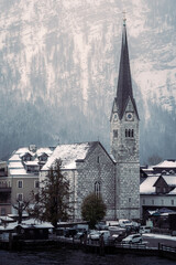 Small church in Hallstatt, Austria during a cold and snowy winter day.