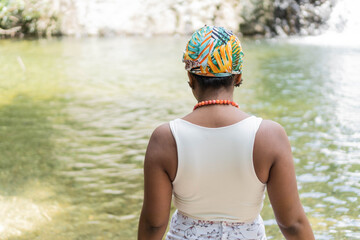 Portrait of a beautiful black woman on the river