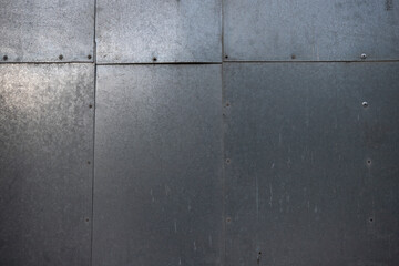 Plaques de métal, morceaux de fer fixés par des rivets. Image pouvant servir de texture ou...