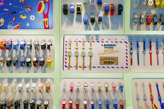 DUBAI, UAE - CIRCA NOVEMBER, 2016: Swatch watches in a store at Dubai International Airport. Swatch is a Swiss watchmaker founded in 1983 by Nicolas Hayek