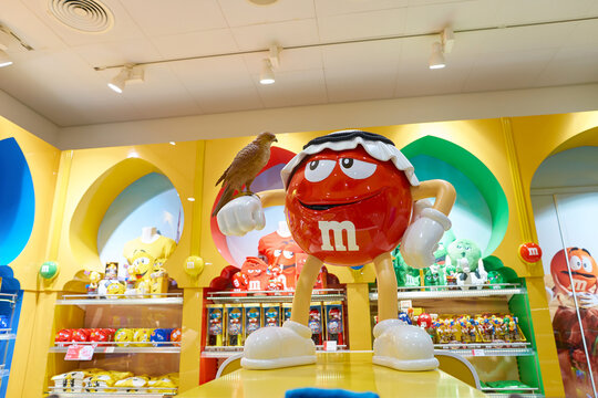 DUBAI, UAE - CIRCA NOVEMBER, 2016: M&M store in Dubai International Airport. M&M's are "colorful button-shaped chocolates" produced by Mars, Incorporated.