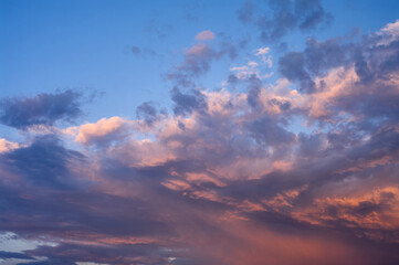 The landscape of the sunset sky, clouds of various shapes and colors create a dramatic scene, natural abstraction
