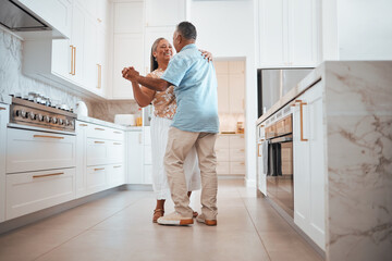 Couple, elderly and dance in kitchen for love, romance and happy together while home in retirement....