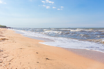 Fototapeta na wymiar The Black Sea in sunny weather. Surf on the beach, waves,sandy shore