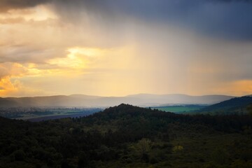 Obraz premium Mountains under cloudy sky as nature background