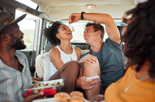 Road Trip, Fruit And Healthy Couple Eating In Van For Countryside Lifestyle, Travel Or Holiday Camping Journey. Relax Friends Or People With Farm Food, Lunch Or Grapes And Games In A Caravan Together