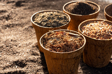 Manure, sawdust, coconut flakes, and vermicompost soil for agriculture and cultivation.