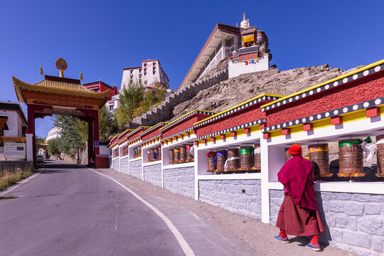 A monk walking towards Thikse Monastery (Thiksay Gompa), Ladakh, India