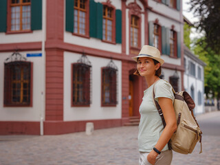 travel to summer Europe young asian woman. Woman having a great vacation in Switzerland, Basel. Lady visiting tourist attractions and landmarks.