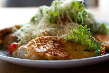 Caesar salad on a plate, close-up