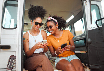 Women, road trip or phone for social media, gps location or map app for safari game drive or summer travel. Smile, happy or bonding friends with 5g mobile technology in camper van in nature landscape - obrazy, fototapety, plakaty