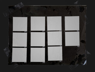 macro photo of black and white handcopy contact sheet with empty film frames fixed by transparent...