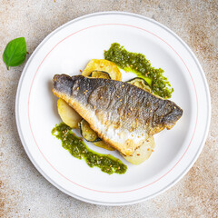 fish sea ​​bass fried, vegetable and seafood meal food snack on the table copy space food background